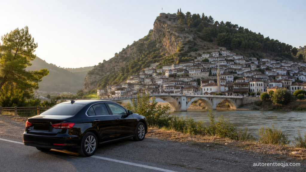 Black rental car overlooking historic Berat in Albania